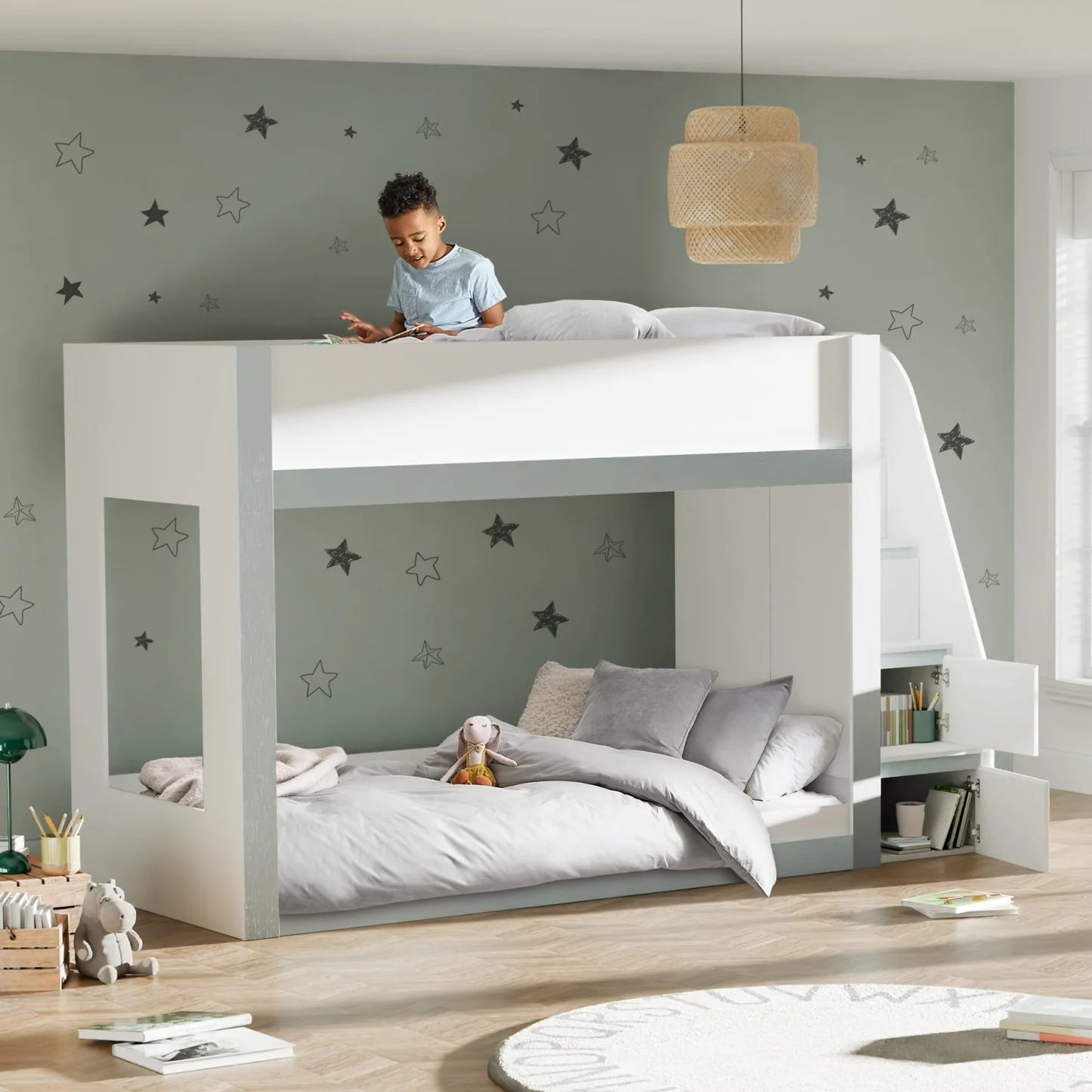 This cool white and silver bunk bed gives a clean, new look to any kids' room. The sturdy ladder to the top bunk has built-in shelves. These are perfect for keeping books, toys, or other items tidy. Made from tough wood, this bunk bed is a great way to save space in shared rooms or when friends sleep over.