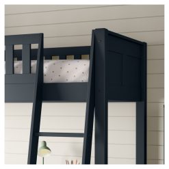 closer angled view of the headboard and slanting ladder on the blue arven high sleeper with single bed and storage desk
