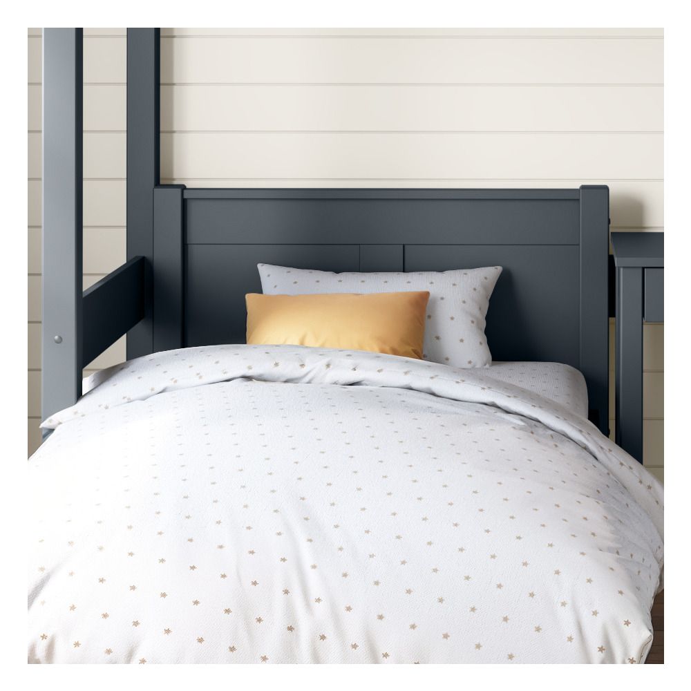 detailed front view of the headboard on the blue arven single bed under the arven high sleeper with single bed and storage desk